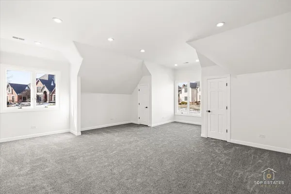 an empty room with a empty space and windows