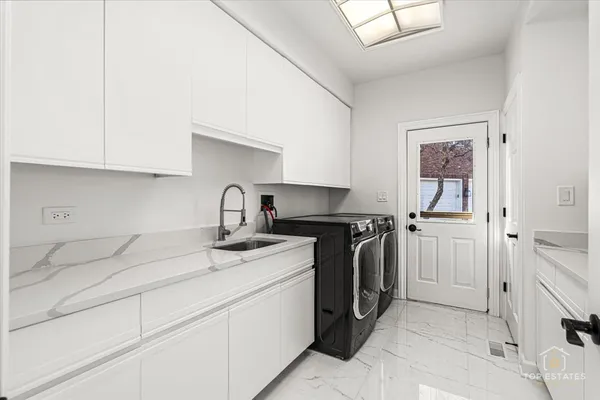 a kitchen with a sink and cabinets