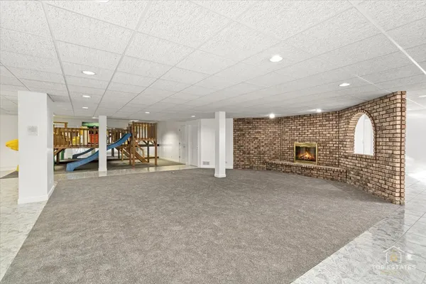 a view of a livingroom with furniture and a garage