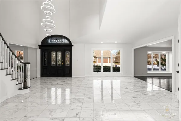 a view of entryway and hall with a front door