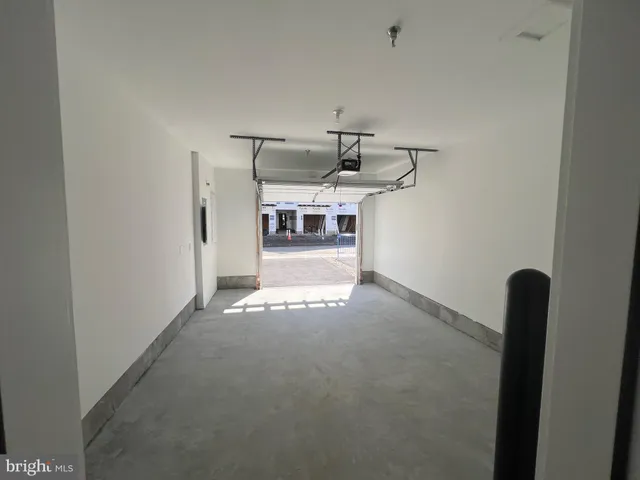 a view of a hallway with a white walls