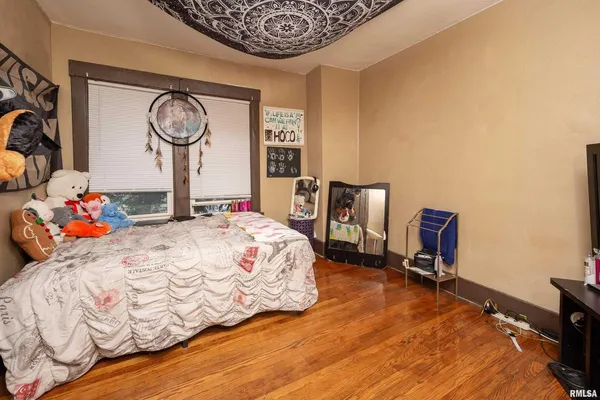 a bedroom with a bed and a table in it