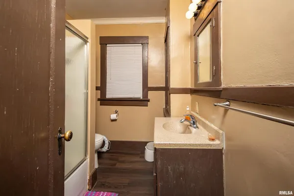a bathroom with a sink and mirror