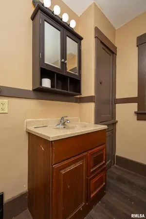 a bathroom with a sink and a mirror