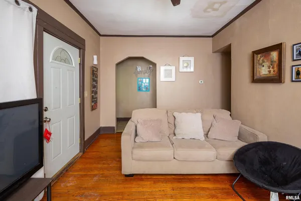 a living room with furniture and a rug