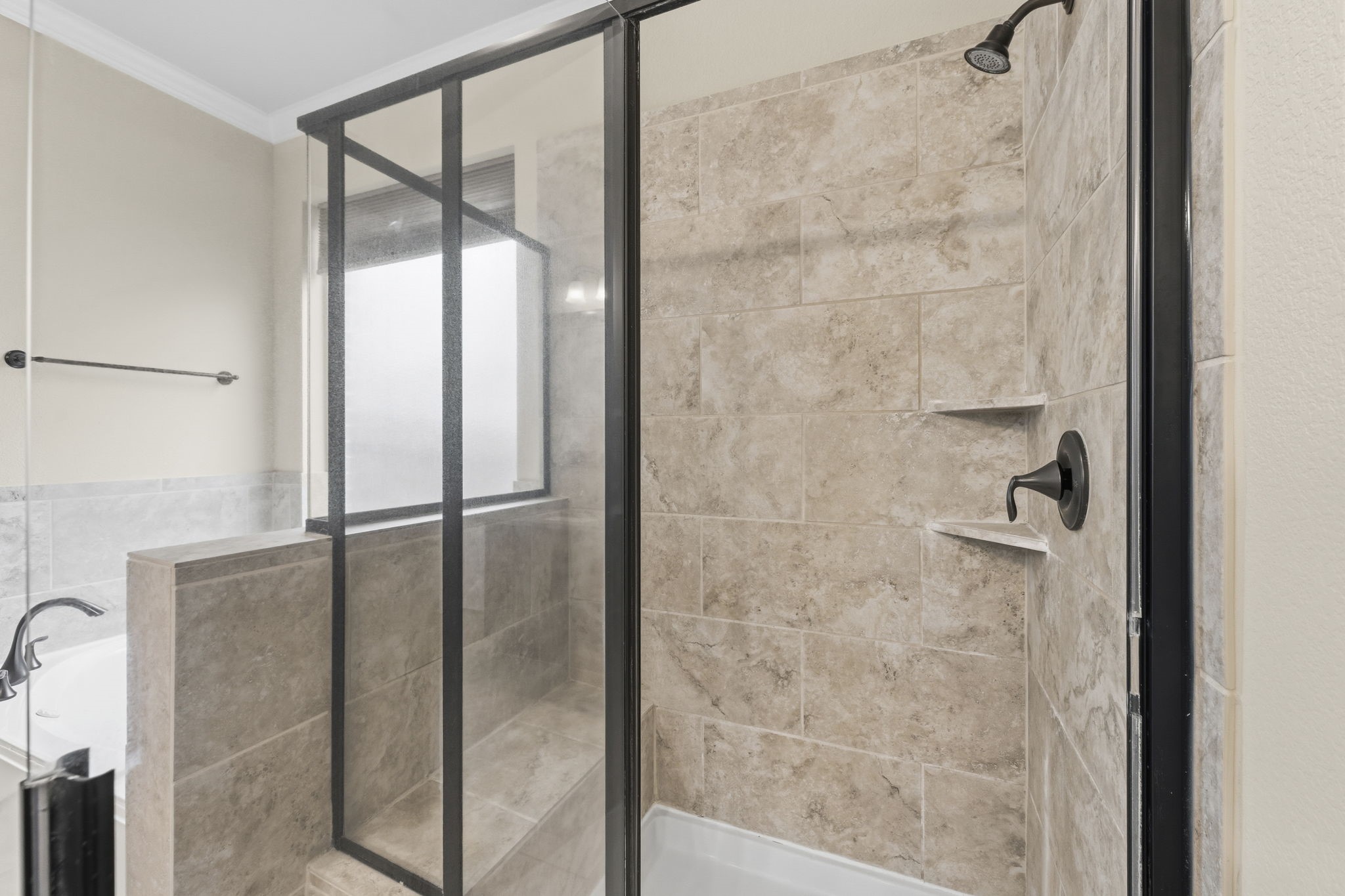 25210 Gaddis Oaks Drive Spring, TX 77389 - Photo 21 of 50 a bathroom with a glass shower door