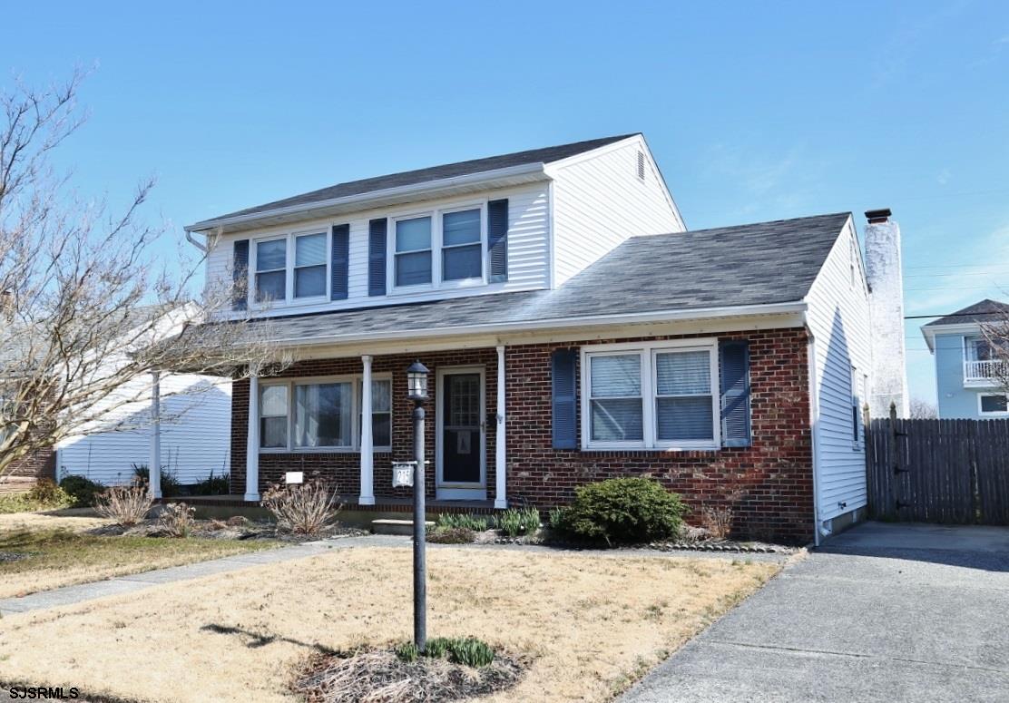 215 27th Street South Brigantine, NJ 08203 - Photo 2 of 23 a front view of a house with a yard