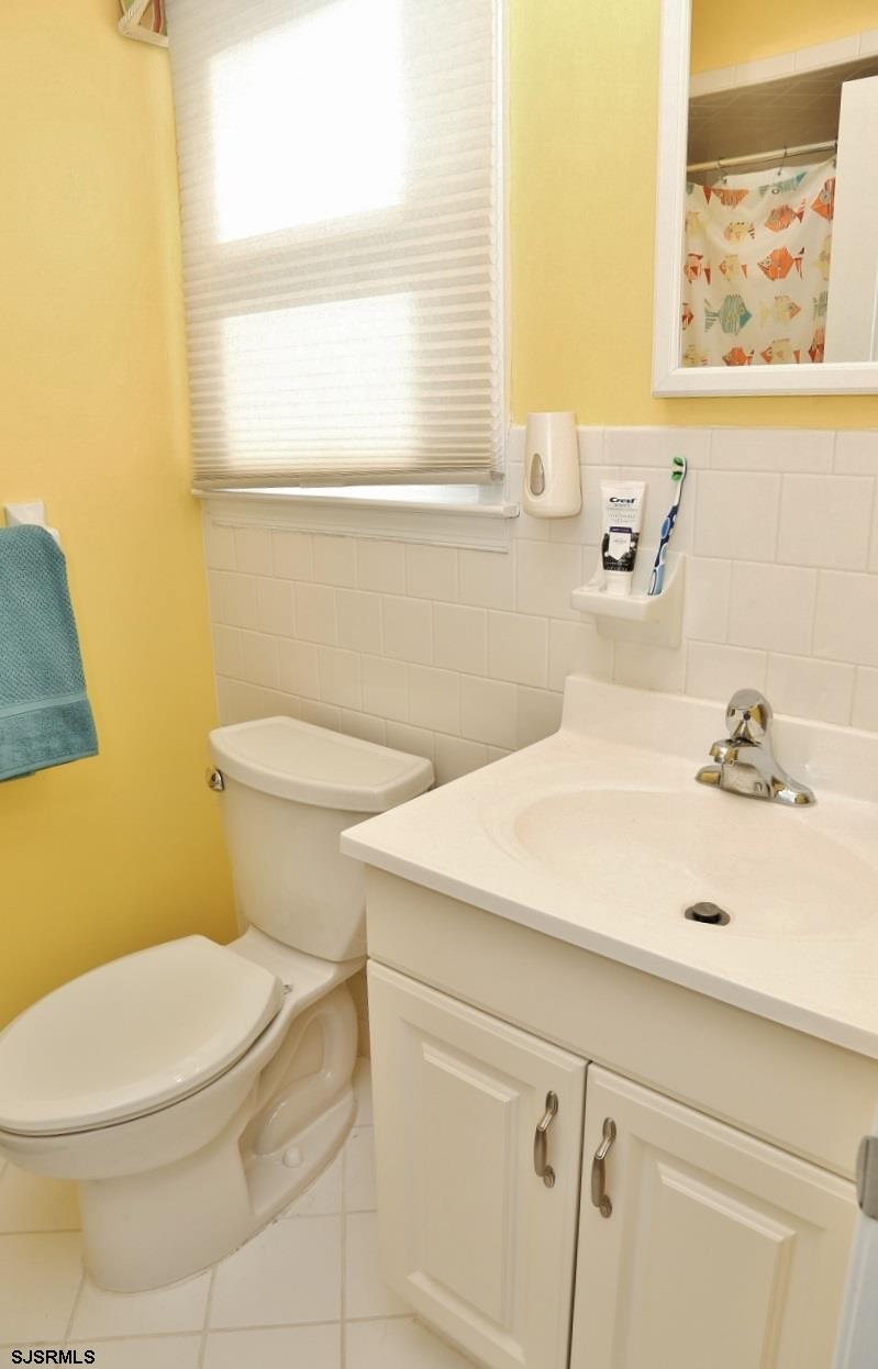 215 27th Street South Brigantine, NJ 08203 - Photo 22 of 23 a bathroom with a sink and a toilet