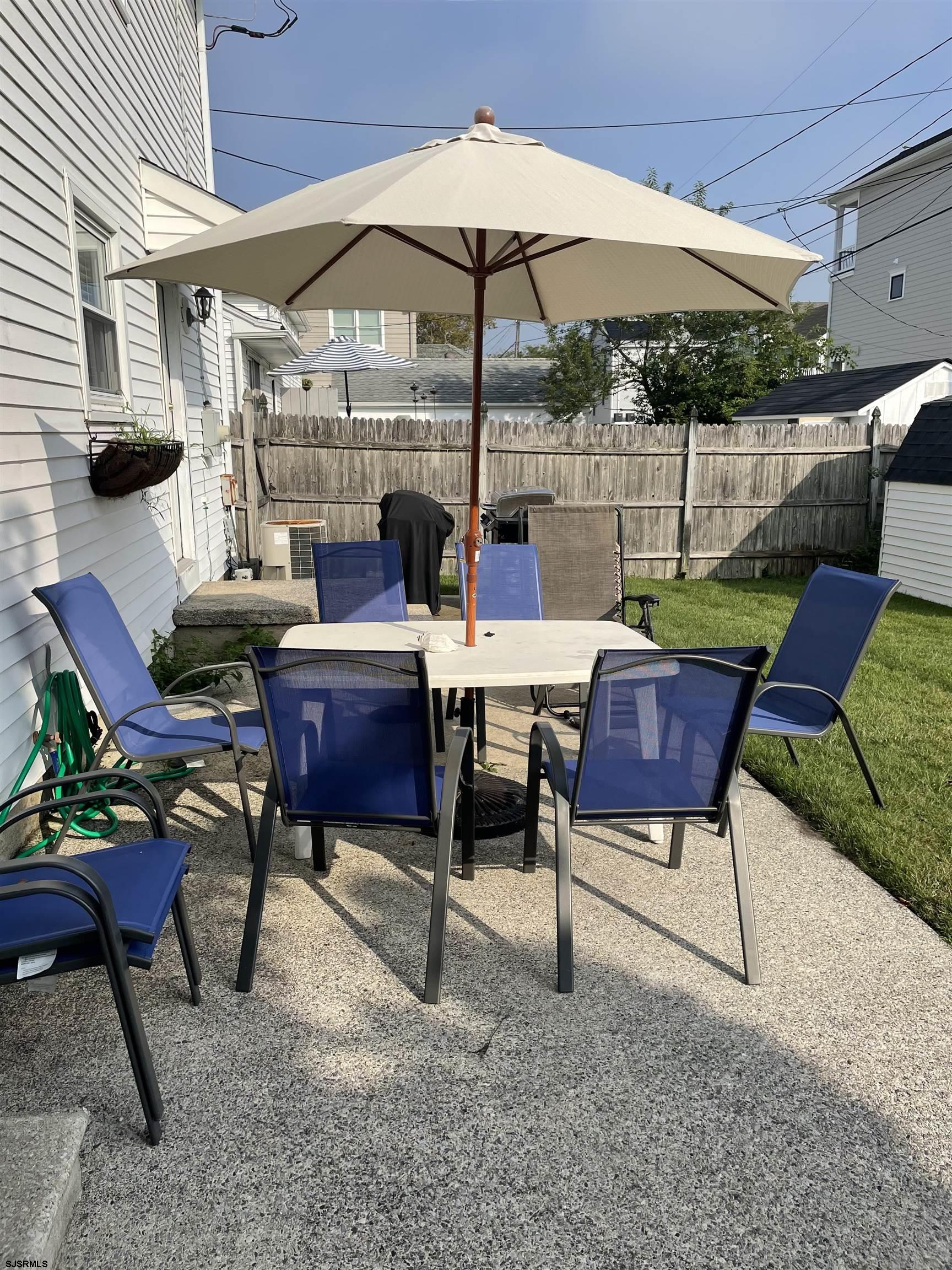 215 27th Street South Brigantine, NJ 08203 - Photo 23 of 23 a view of a backyard with sitting area and furniture