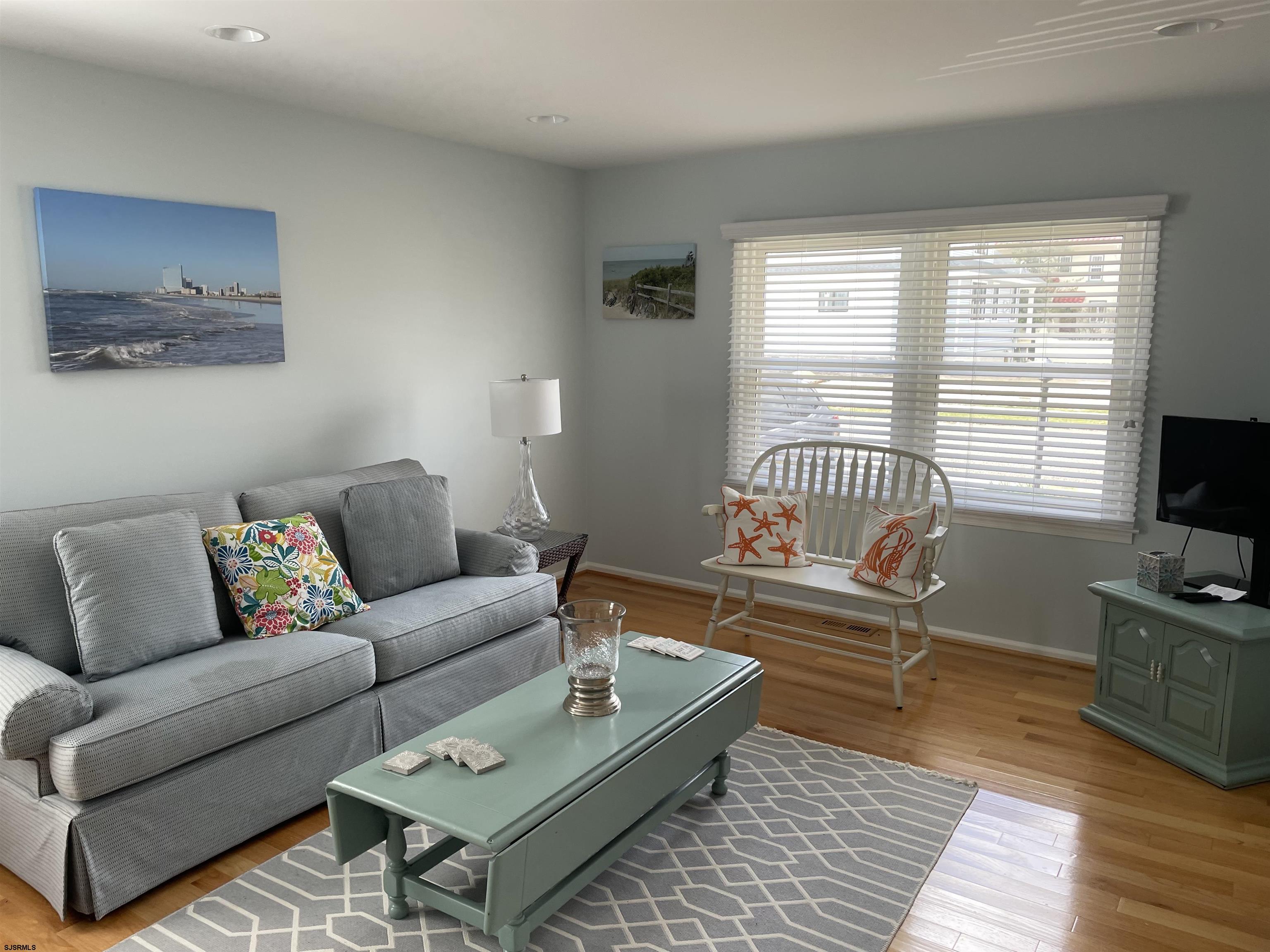 215 27th Street South Brigantine, NJ 08203 - Photo 4 of 23 a living room with furniture and a flat screen tv