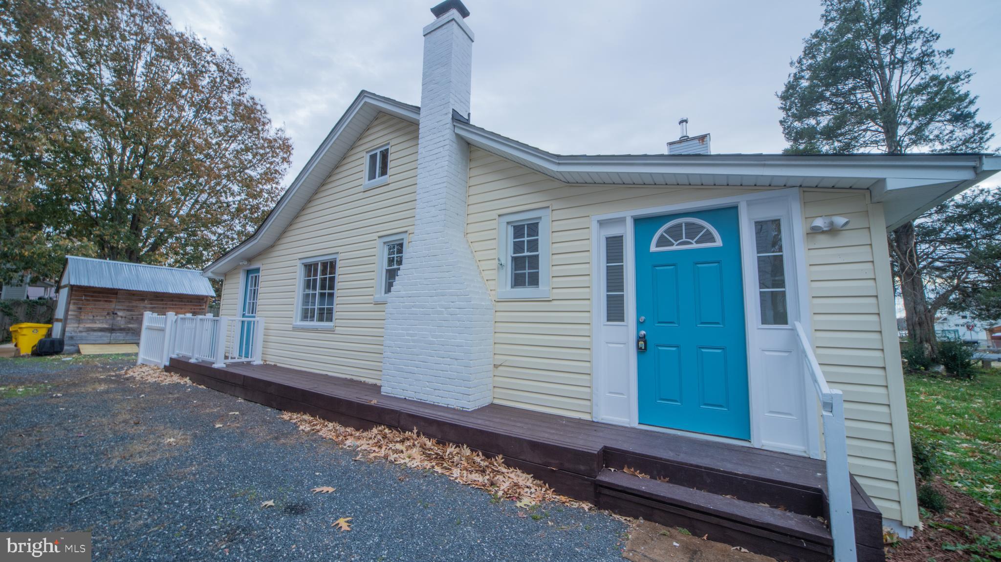 4955 Chestnut Street Shady Side, MD 20764 - Photo 2 of 22 a front view of a house with garden