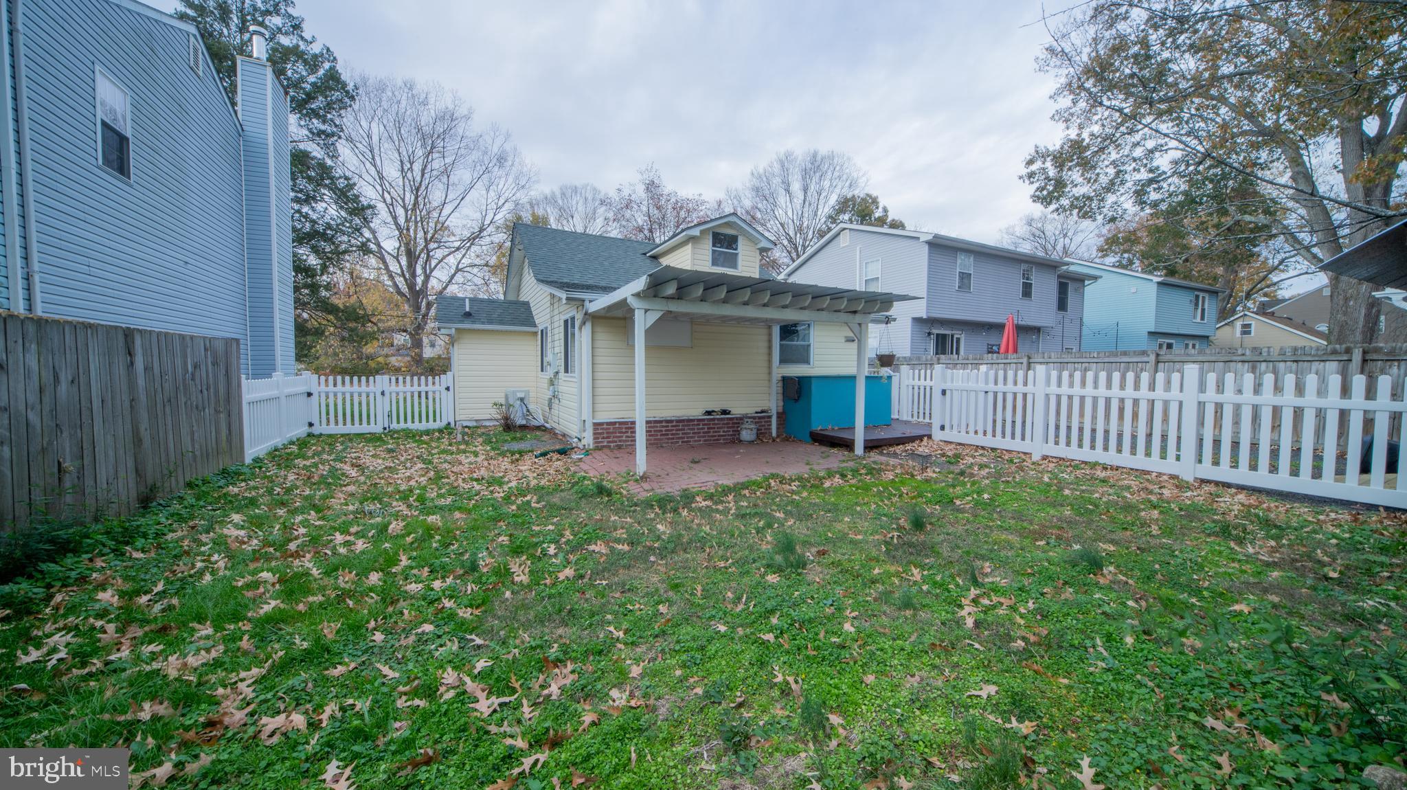4955 Chestnut Street Shady Side, MD 20764 - Photo 21 of 22 a view of a house with a small yard and a garden