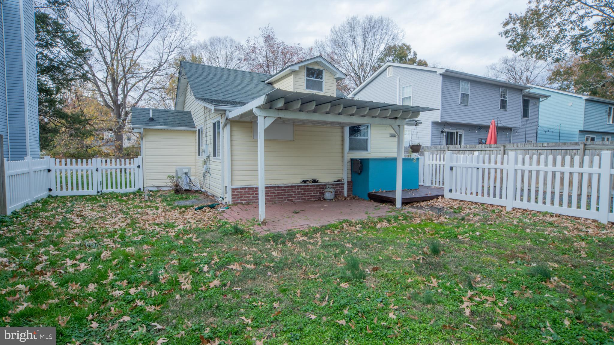 4955 Chestnut Street Shady Side, MD 20764 - Photo 22 of 22 a view of a house with a small yard and wooden fence