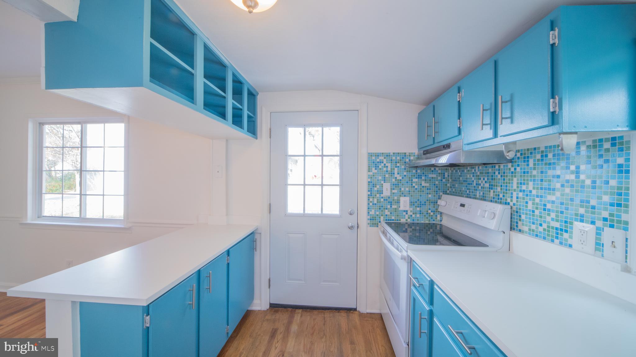 4955 Chestnut Street Shady Side, MD 20764 - Photo 7 of 22 a kitchen with a sink and wooden cabinets