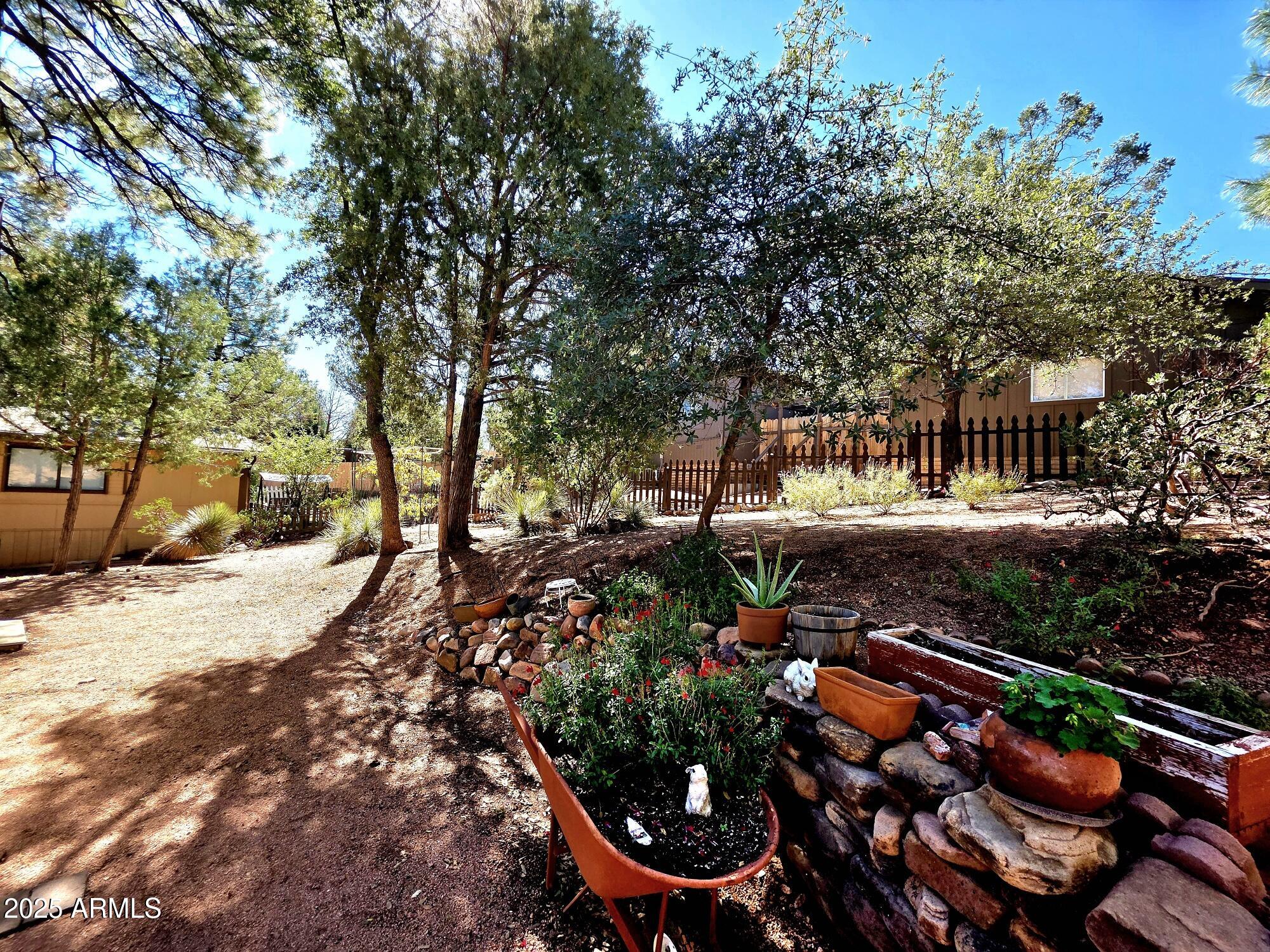 835 West Overland Road Payson, AZ 85541 - Photo 7 of 31 a backyard of a house with lots of green space