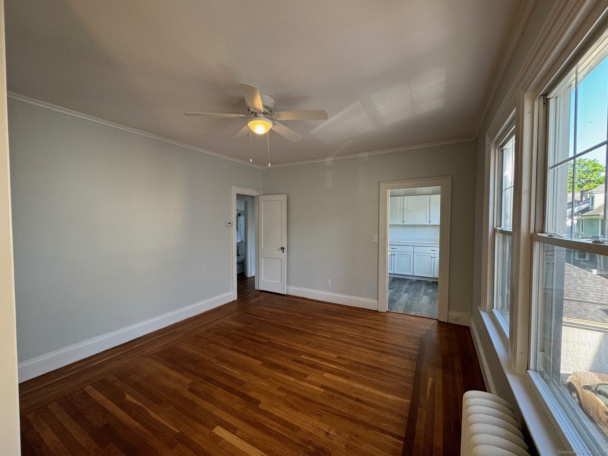 1253 Forest Road, Unit 2 New Haven, CT 06515 - Photo 15 of 30 a view of empty room with wooden floor and fan