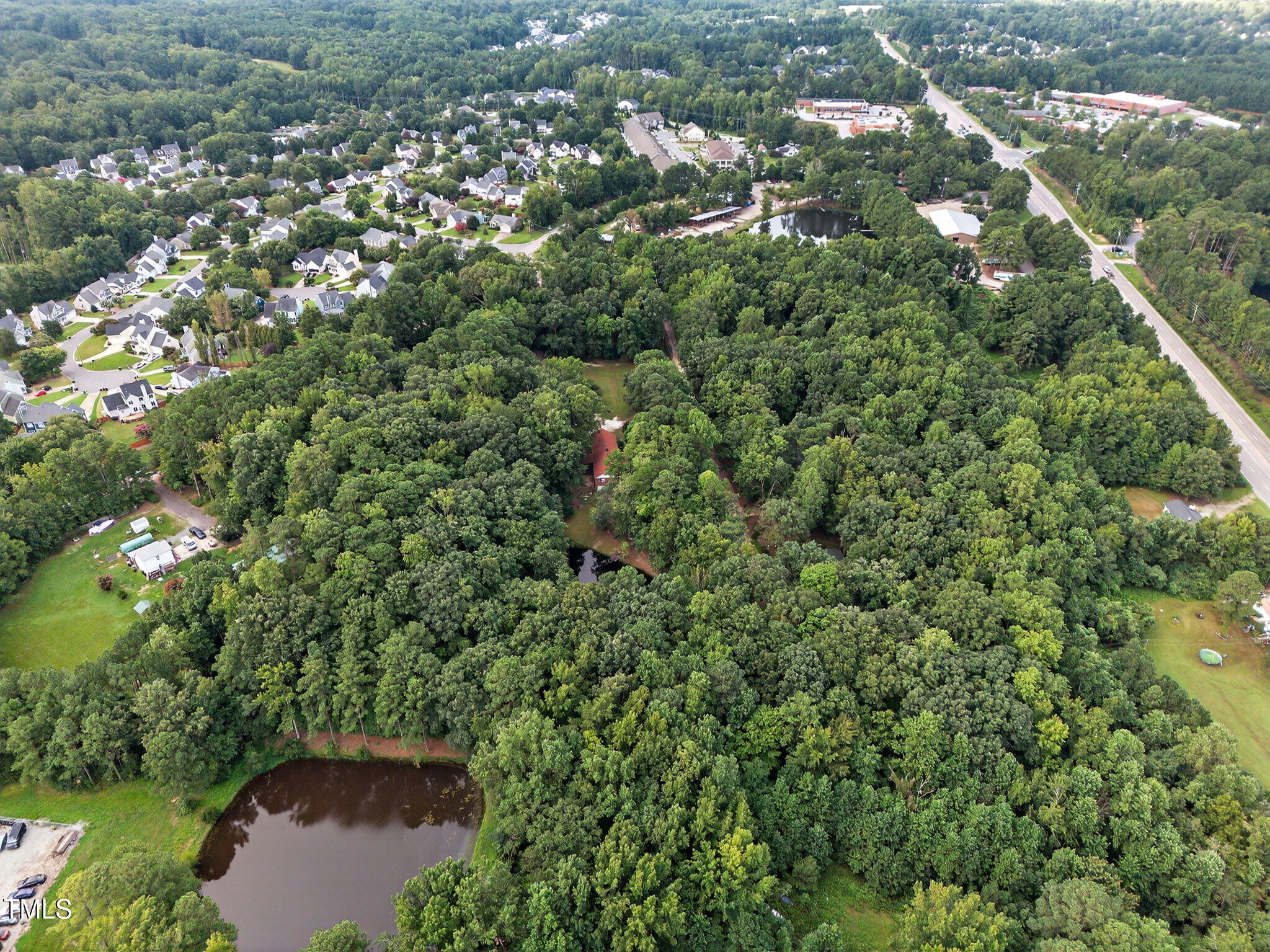 705 Oak Ridge Drive Cary, NC 27519 - Photo 14 of 31 an aerial view of a residential houses with outdoor space and trees