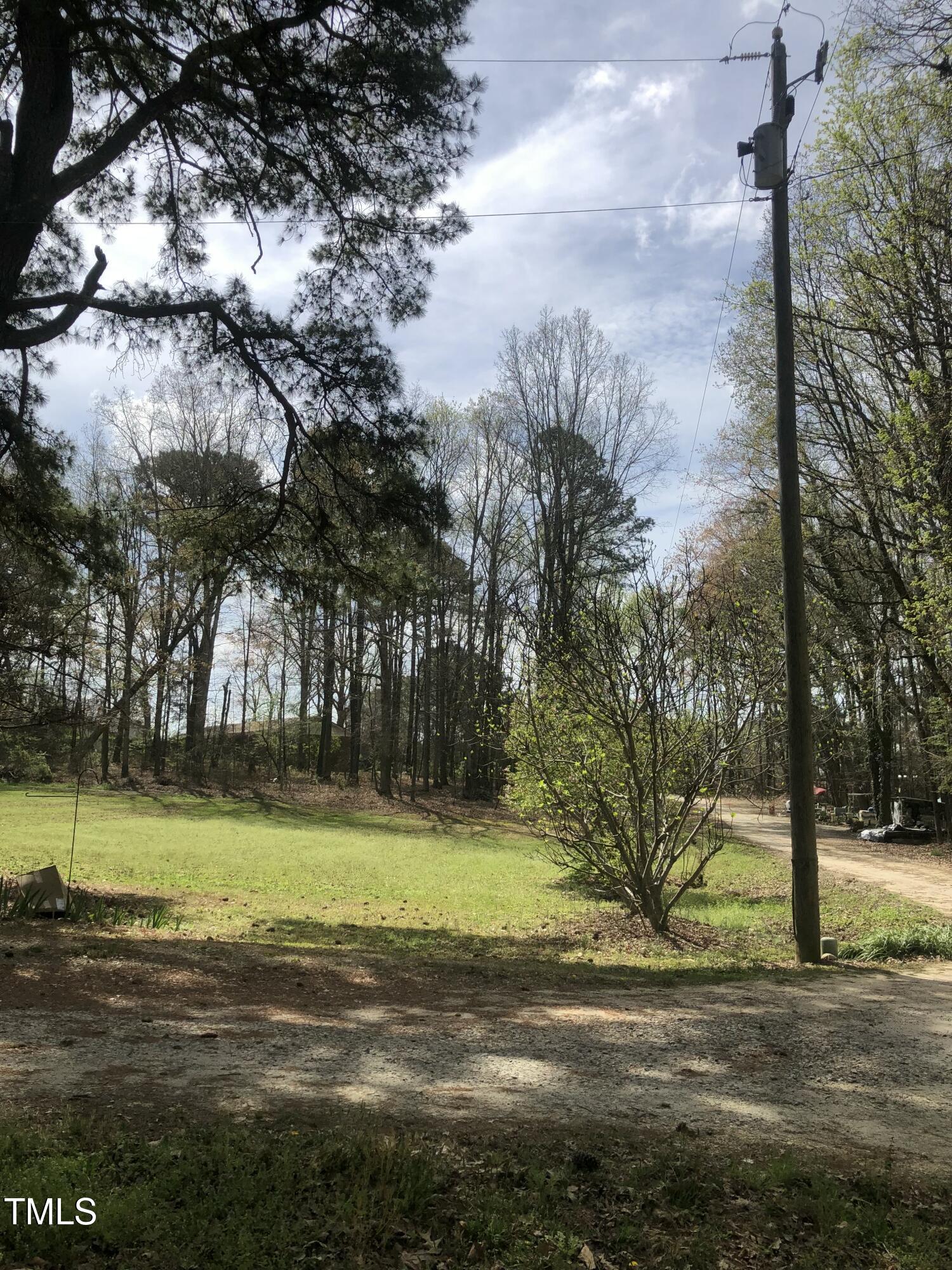 705 Oak Ridge Drive Cary, NC 27519 - Photo 24 of 31 a view of a yard with a house in the background