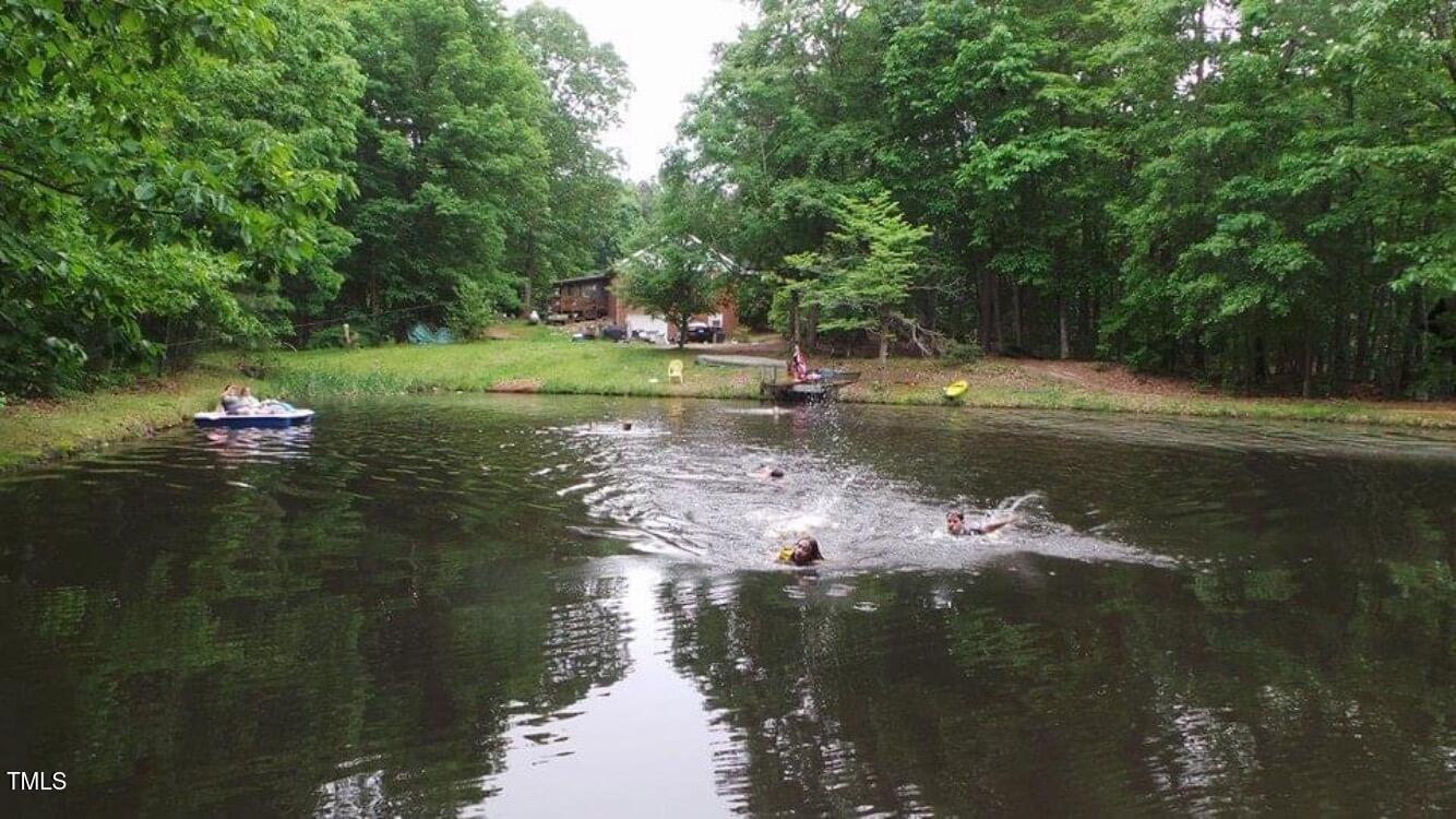 705 Oak Ridge Drive Cary, NC 27519 - Photo 27 of 31 a view of a lake from a yard