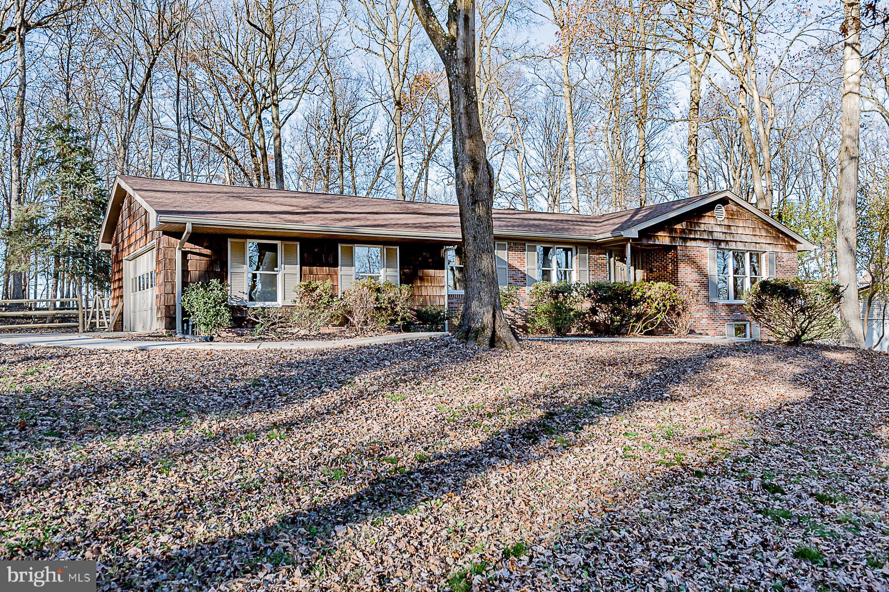 12008 Mettee Road Marriottsville, MD 21104 - Photo 2 of 36 a view of a house with backyard and a tree