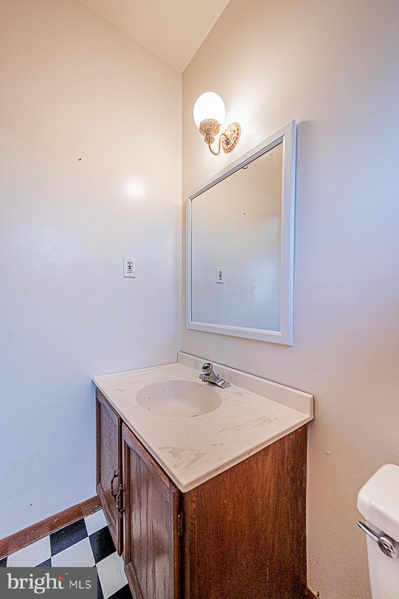 12008 Mettee Road Marriottsville, MD 21104 - Photo 14 of 36 a bathroom with a sink and a mirror