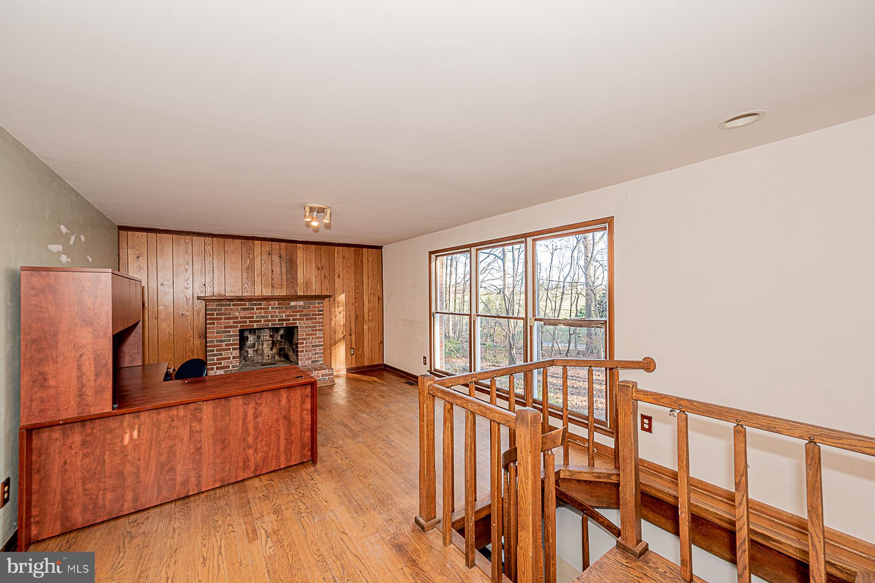 12008 Mettee Road Marriottsville, MD 21104 - Photo 15 of 36 a kitchen with stainless steel appliances kitchen island granite countertop a refrigerator a stove a sink and dishwasher with wooden floor