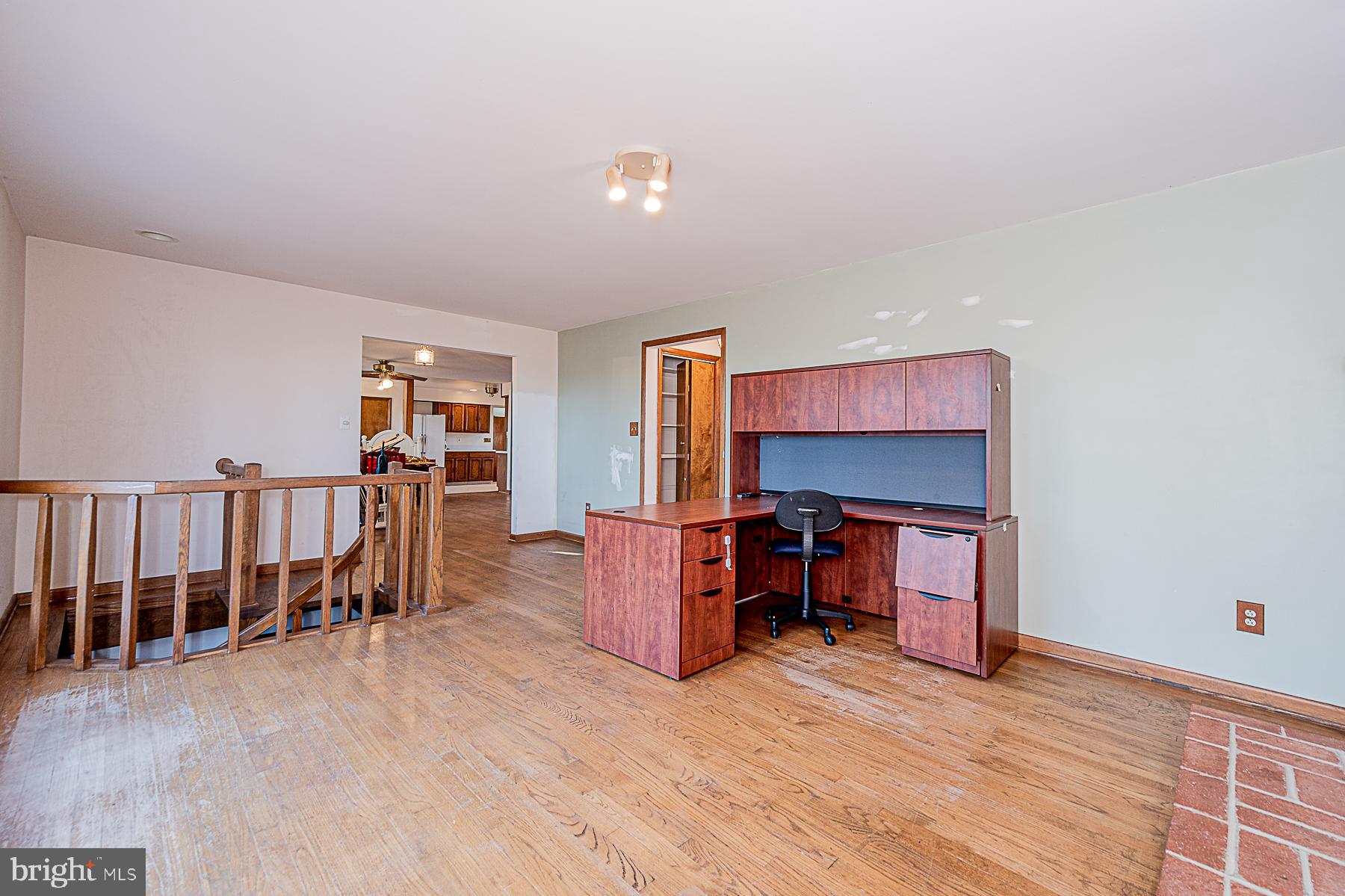 12008 Mettee Road Marriottsville, MD 21104 - Photo 16 of 36 a living room with furniture and a wooden floor