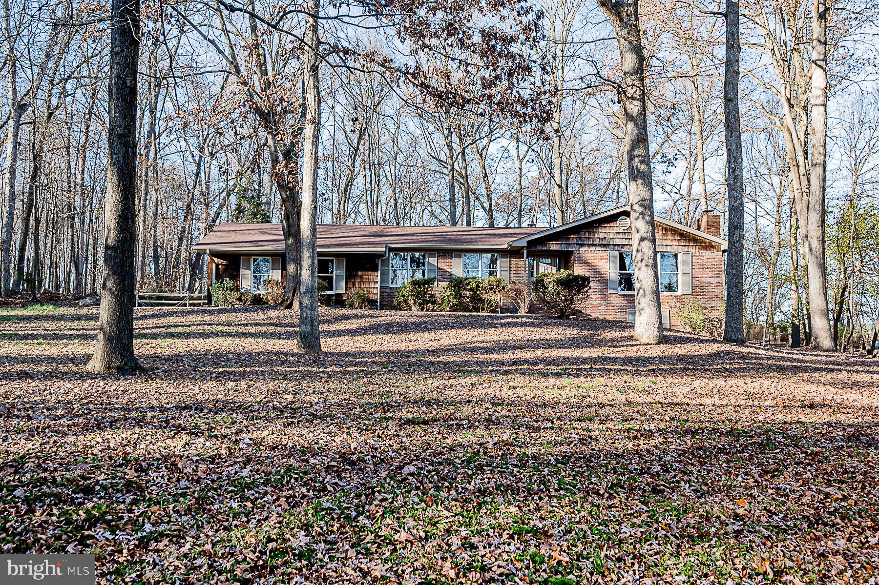 12008 Mettee Road Marriottsville, MD 21104 - Photo 3 of 36 a front view of a house with a tree