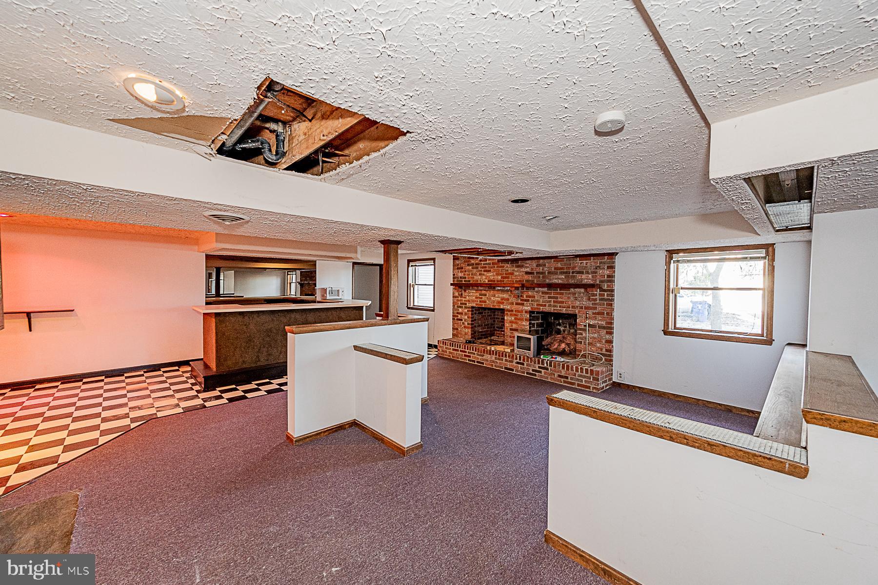 12008 Mettee Road Marriottsville, MD 21104 - Photo 24 of 36 a view of a livingroom with furniture and a flat screen tv