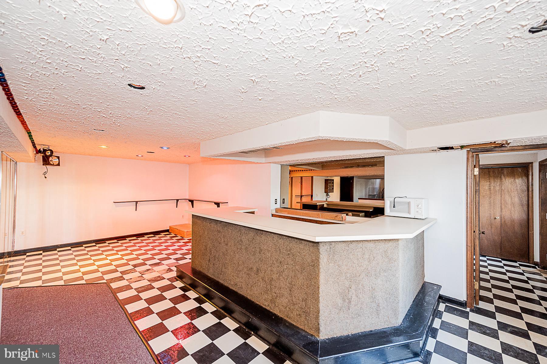 12008 Mettee Road Marriottsville, MD 21104 - Photo 26 of 36 a living room with a sink a stove and a microwave oven