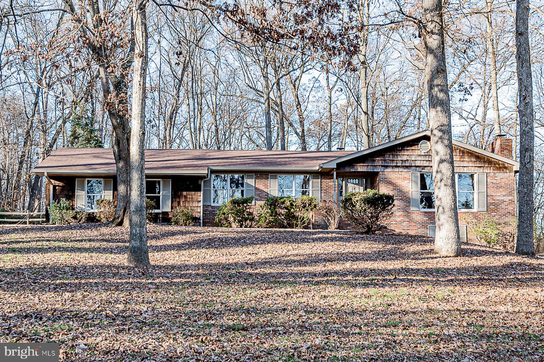 12008 Mettee Road Marriottsville, MD 21104 - Photo 4 of 36 a front view of a house with garden