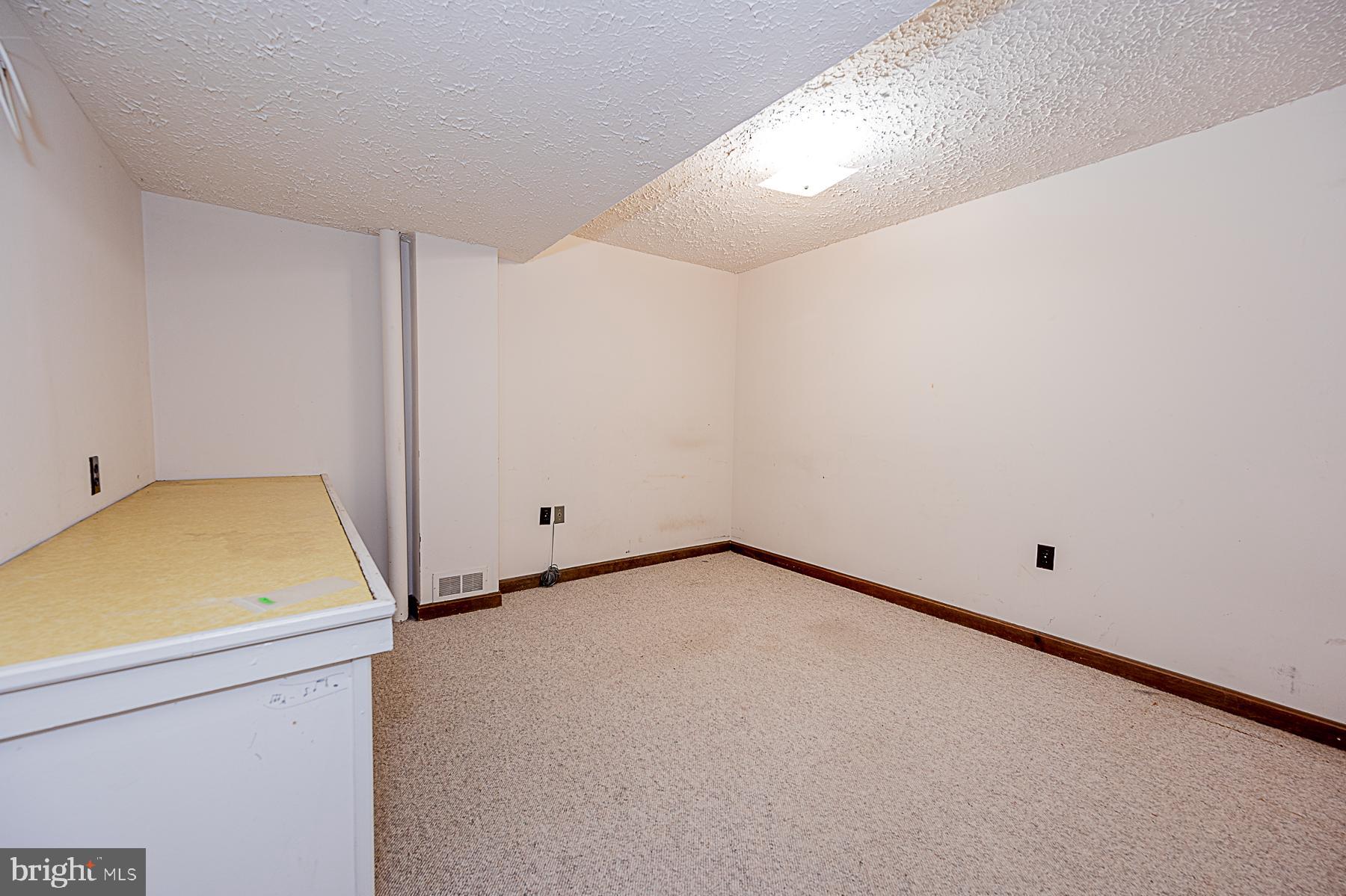 12008 Mettee Road Marriottsville, MD 21104 - Photo 31 of 36 a view of a room with wooden floor