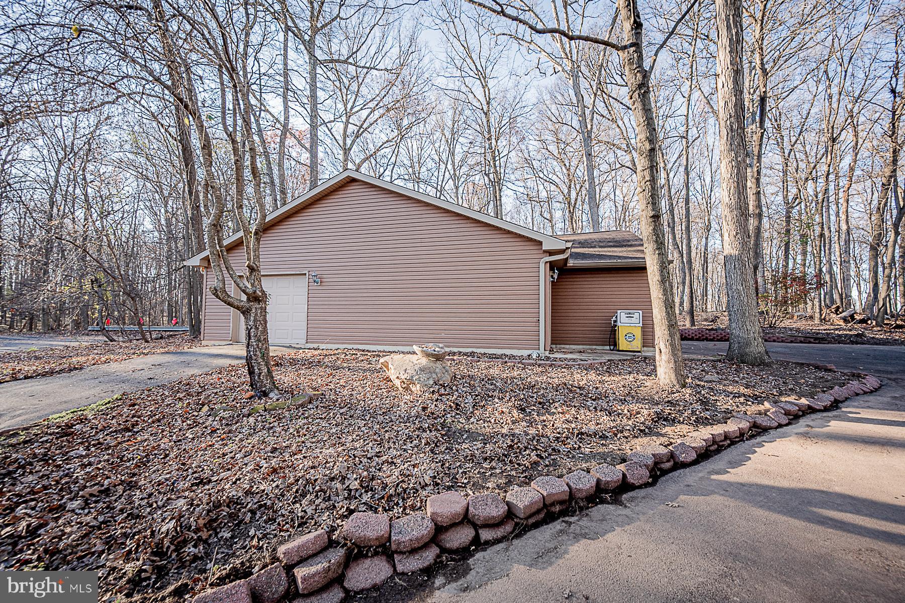 12008 Mettee Road Marriottsville, MD 21104 - Photo 6 of 36 a backyard of a house with lots of green space