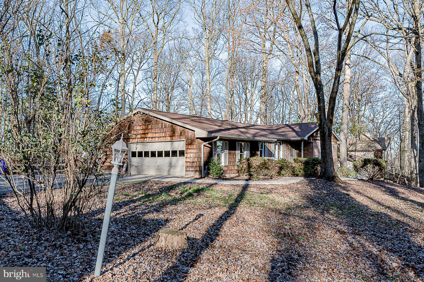 12008 Mettee Road Marriottsville, MD 21104 - Photo 7 of 36 a house that has a tree in it