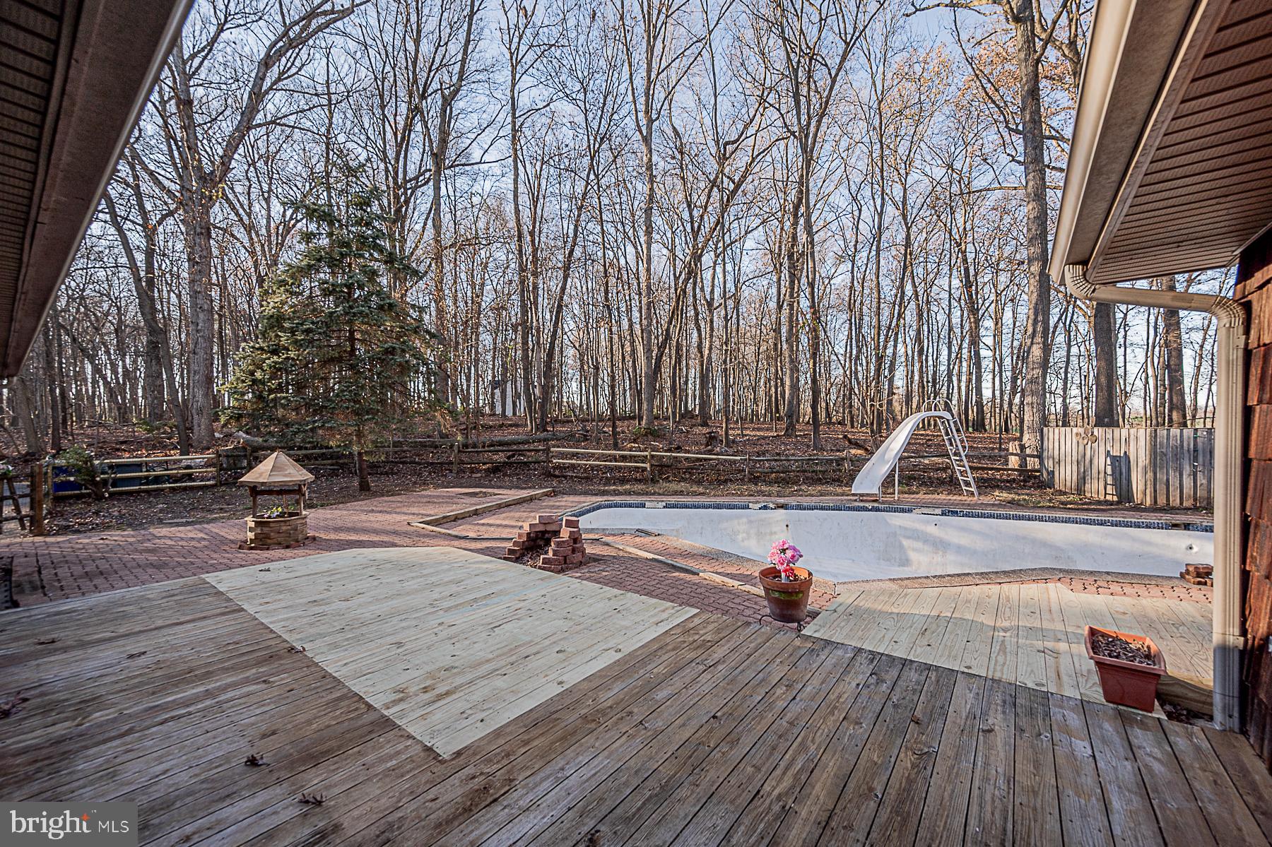 12008 Mettee Road Marriottsville, MD 21104 - Photo 9 of 36 a view of a backyard with wooden floor