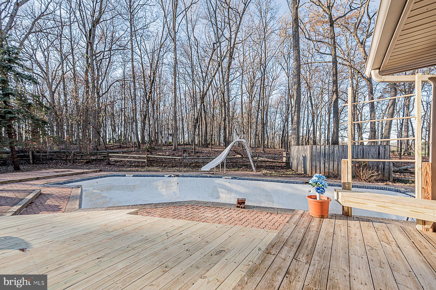12008 Mettee Road Marriottsville, MD 21104 - Photo 10 of 36 a view of a swimming pool with a lounge chairs