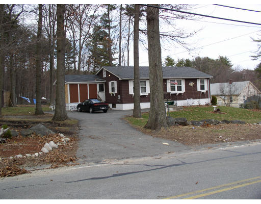 45 Parham Road Tyngsborough, MA 01879 - Photo 2 of 3 front view of a house with a yard