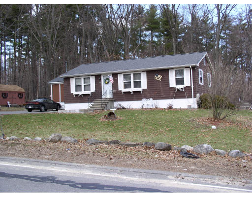 45 Parham Road Tyngsborough, MA 01879 - Photo 3 of 3 a front view of a house with a yard