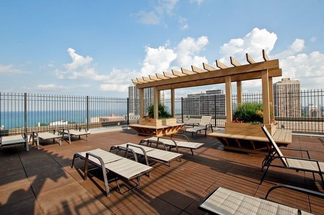 2930 North Sheridan Road, Unit 805 Chicago, IL 60657 - Photo 16 of 21 a living room with furniture and a large window