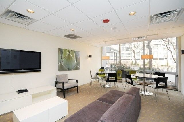 2930 North Sheridan Road, Unit 805 Chicago, IL 60657 - Photo 17 of 21 a living room with furniture and a flat screen tv