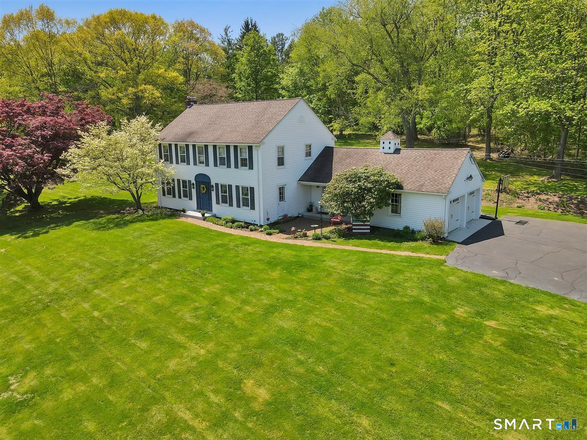 Situated beautifully on its 3.7 acre lot