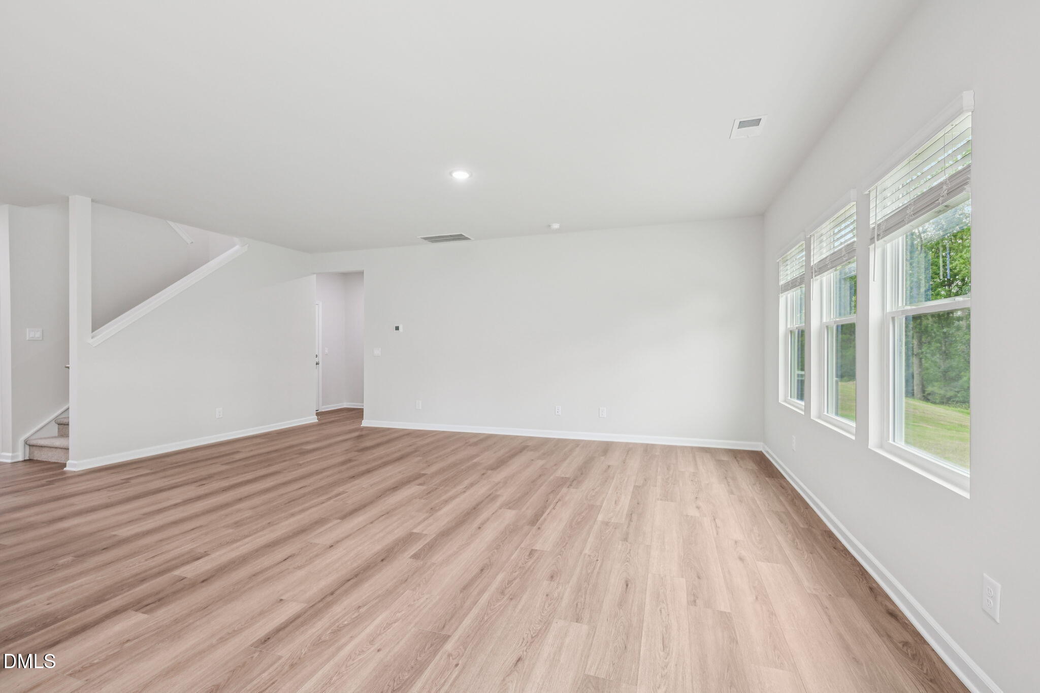 2145 Topsail Road Durham, NC 27703 - Photo 9 of 53 wooden floor in an empty room with a window