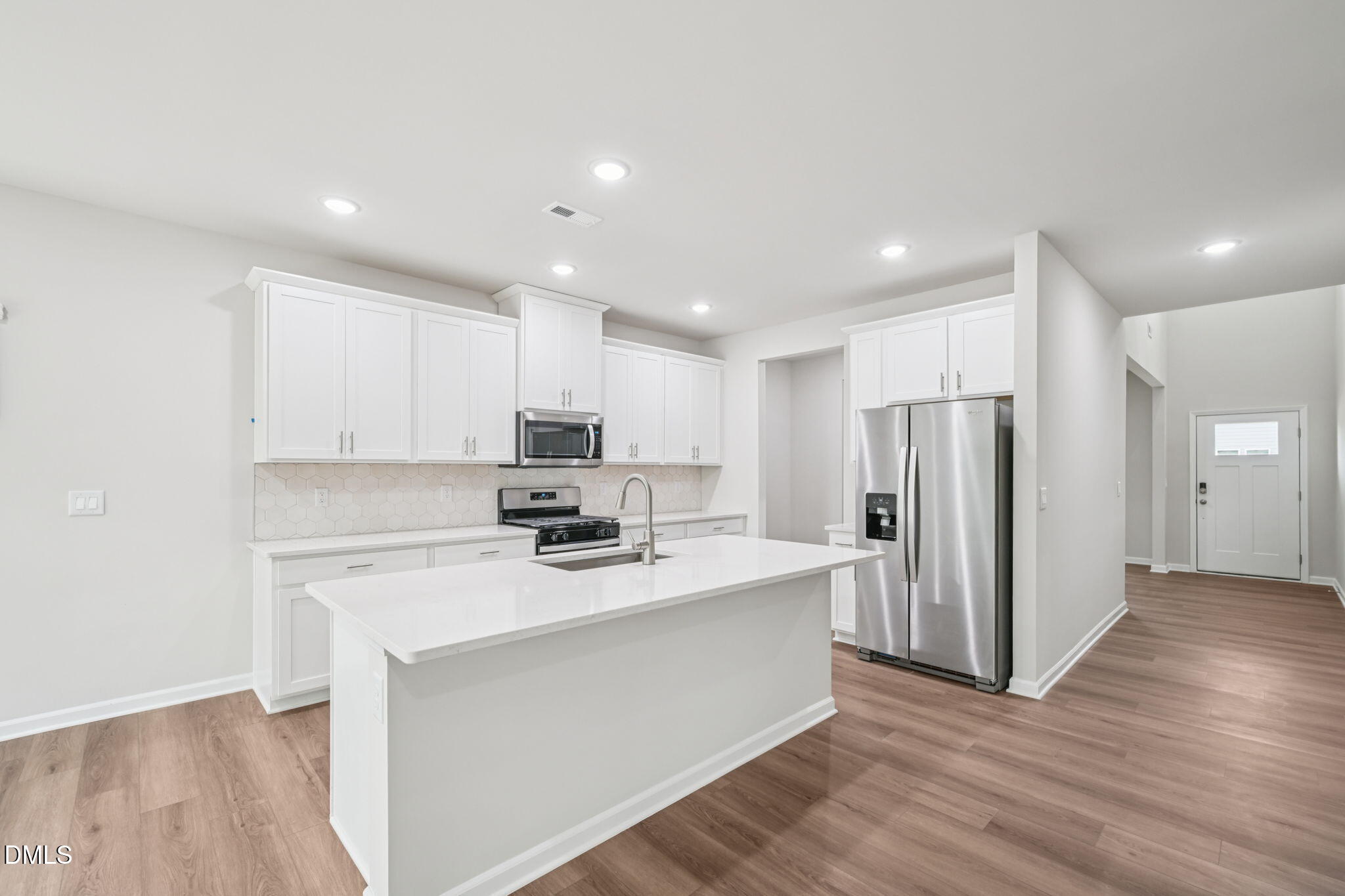 2145 Topsail Road Durham, NC 27703 - Photo 17 of 53 a kitchen with stainless steel appliances a refrigerator sink and microwave