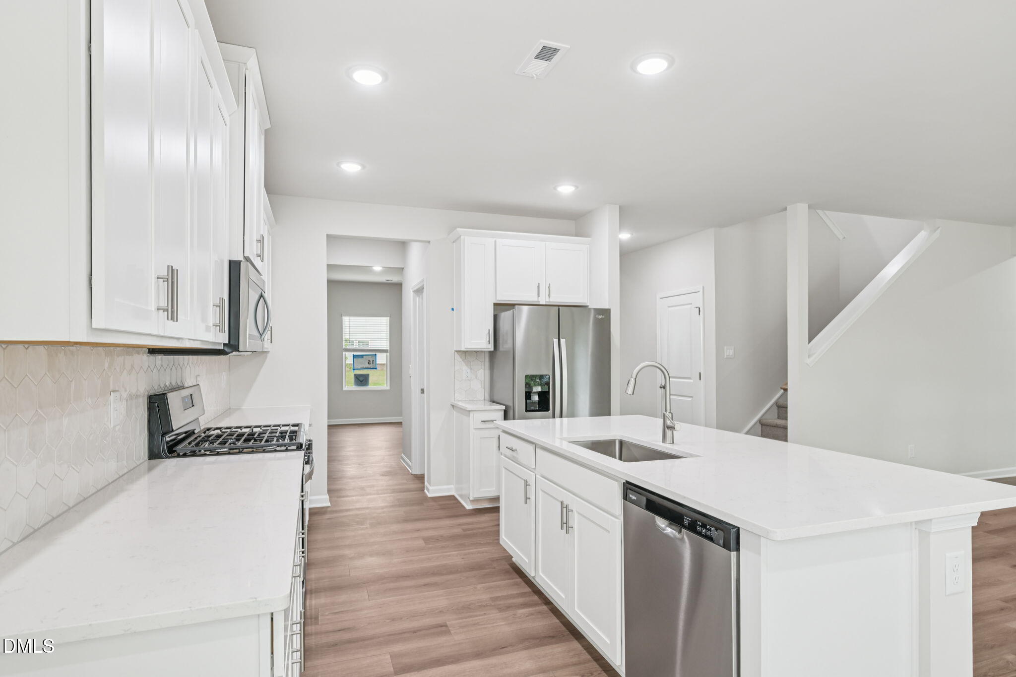 2145 Topsail Road Durham, NC 27703 - Photo 21 of 53 a large white kitchen with a large window