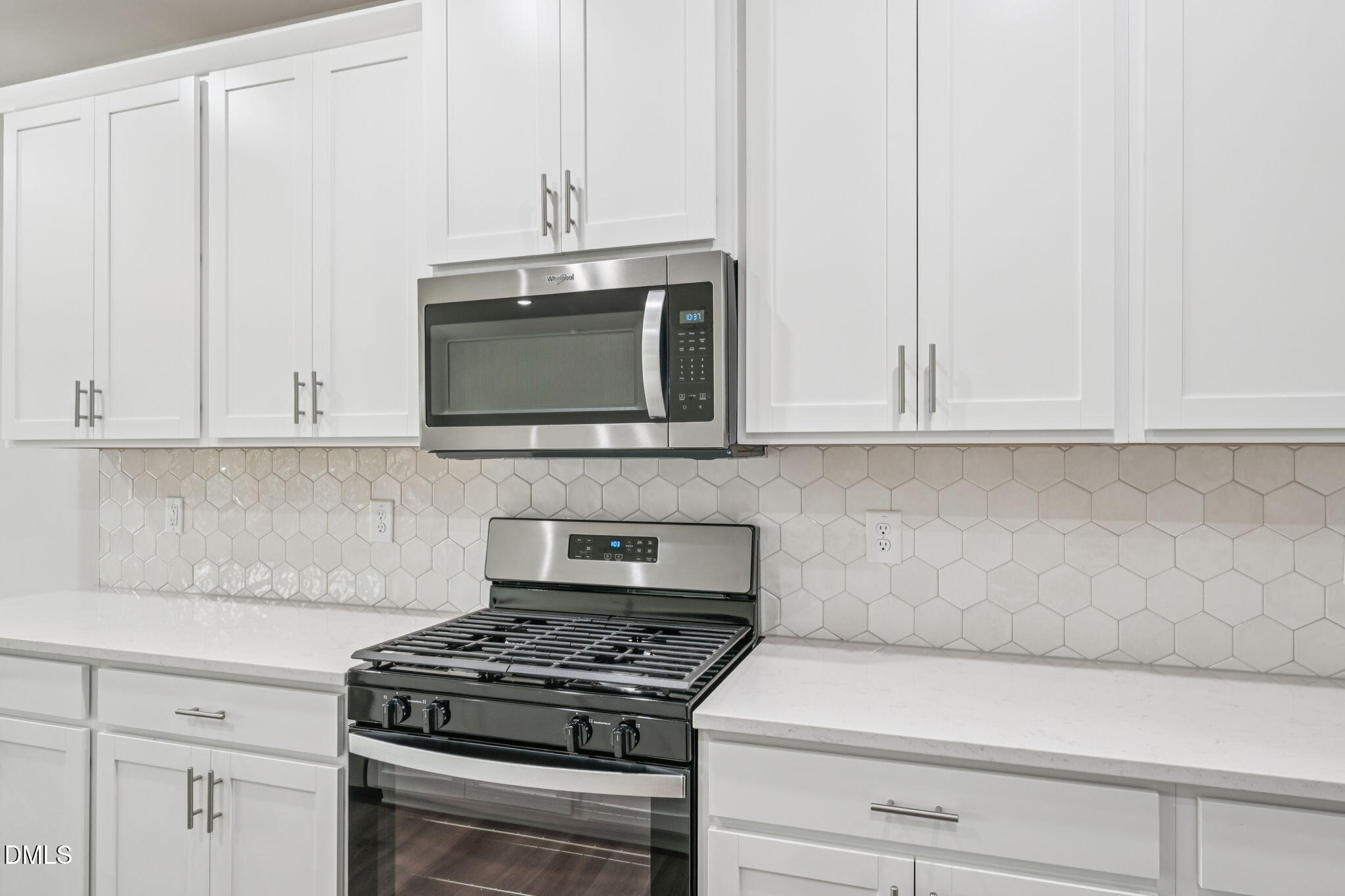 2145 Topsail Road Durham, NC 27703 - Photo 22 of 53 a kitchen with stainless steel appliances white cabinets and a stove top oven