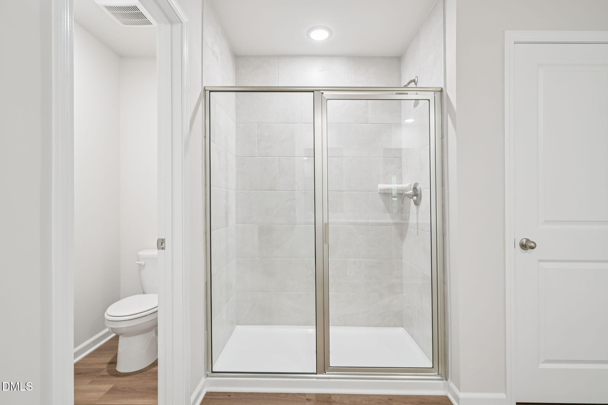 2145 Topsail Road Durham, NC 27703 - Photo 41 of 53 a bathroom with a shower and a toilet