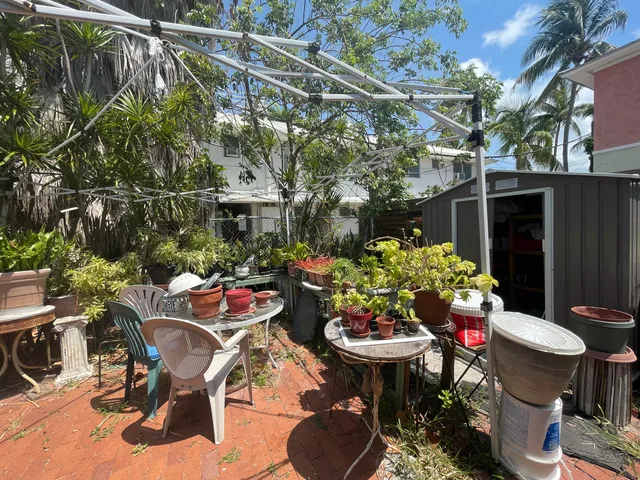 a view of a chairs and table in a patio