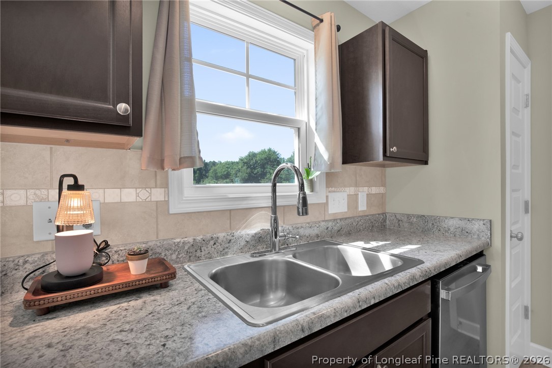 351 Sandy Grove Road Parkton, NC 28371 - Photo 13 of 30 a kitchen with sink and window