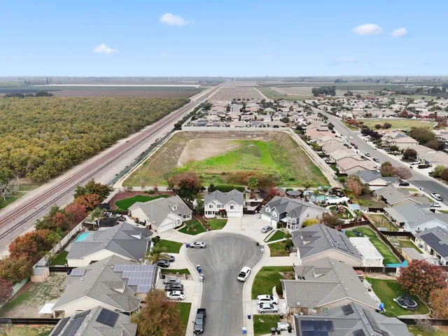 a view of a backyard with sitting area