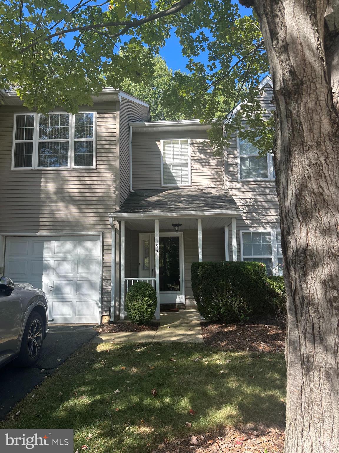 194 Victoria Court Doylestown, PA 18901 - Photo 2 of 20 a front view of a house with a garden